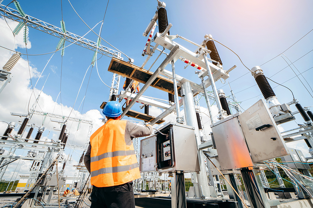 Adult electrical engineer inspect the electrical systems at the Electrical utility worker
